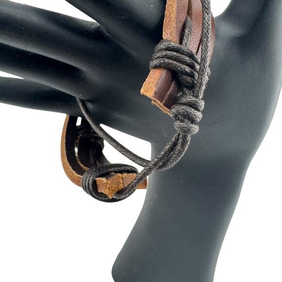 Feral Braided Leather Cuff: Adjustable Anarchy for Any Wrist - Picture 2 of 3